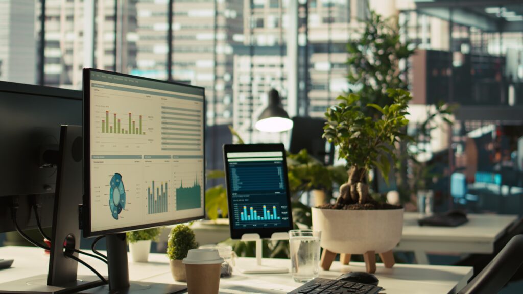 modern workspace with analytical data dashboards displayed on devices